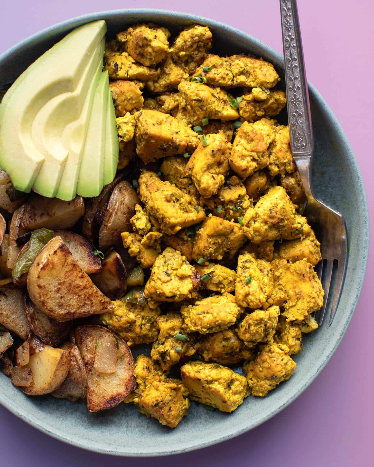 The best scrambled tofu served with homefries and avocado