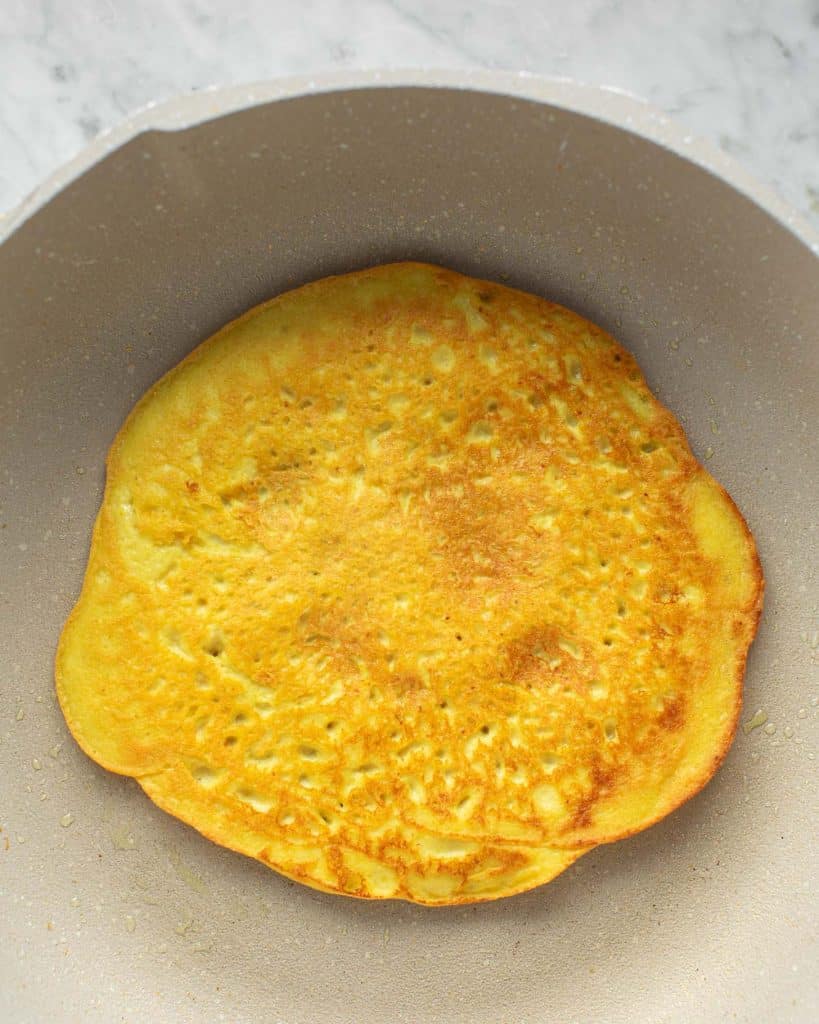 tofu omelet flipped in the pan