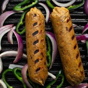 Vegan Italian sausage grilled in cast iron
