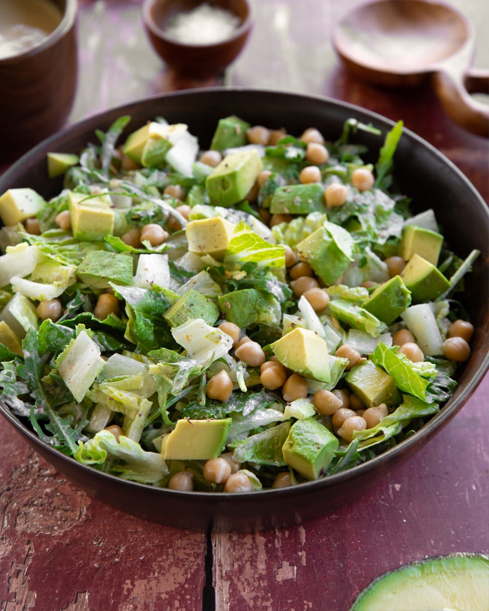 Classic vegan Caesar salad with chickpeas and avocado and a tahini based dressing