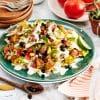 Vegan breakfast nachos with scrambled tofu, black beans, cashew cheese, sour cream, avocado salsa