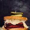 Vegan Tempeh Beet Reubens with a homemade vegan swiss cheese
