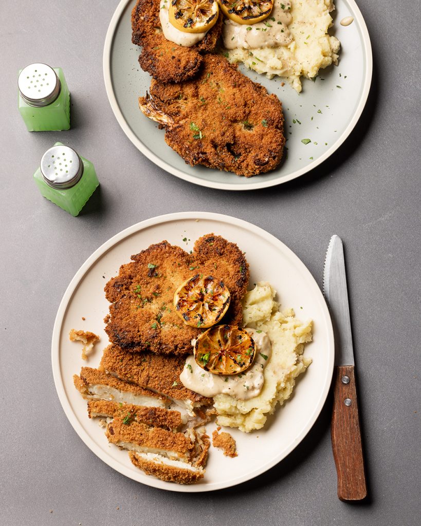 Cauliflower schnitzel with mashed potatoes and mustard sauce, sliced and gorgeous