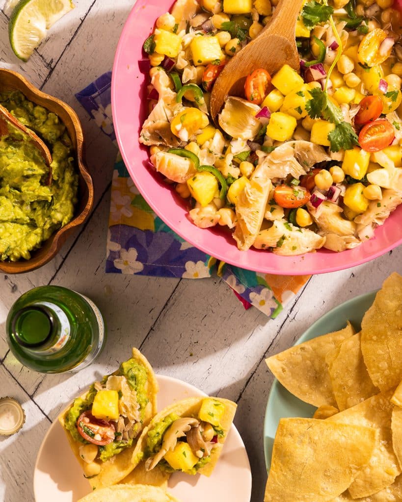 Vegan mushroom ceviche with pineapple, chickpeas, and oyster mushrooms served with tortilla chips and guacamole