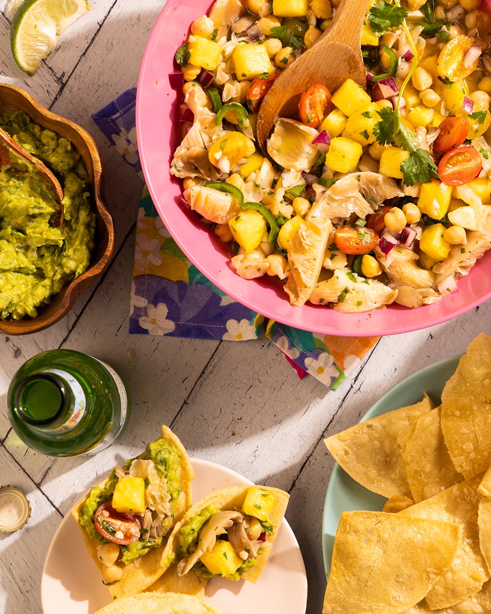 Vegan mushroom ceviche with pineapple, chickpeas, and oyster mushrooms served with tortilla chips and guacamole