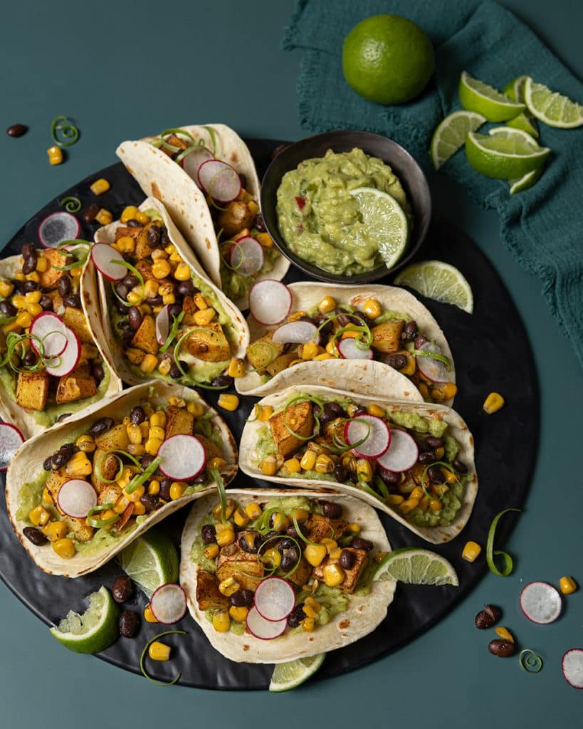 Vegan potato tacos with black beans and guacamole