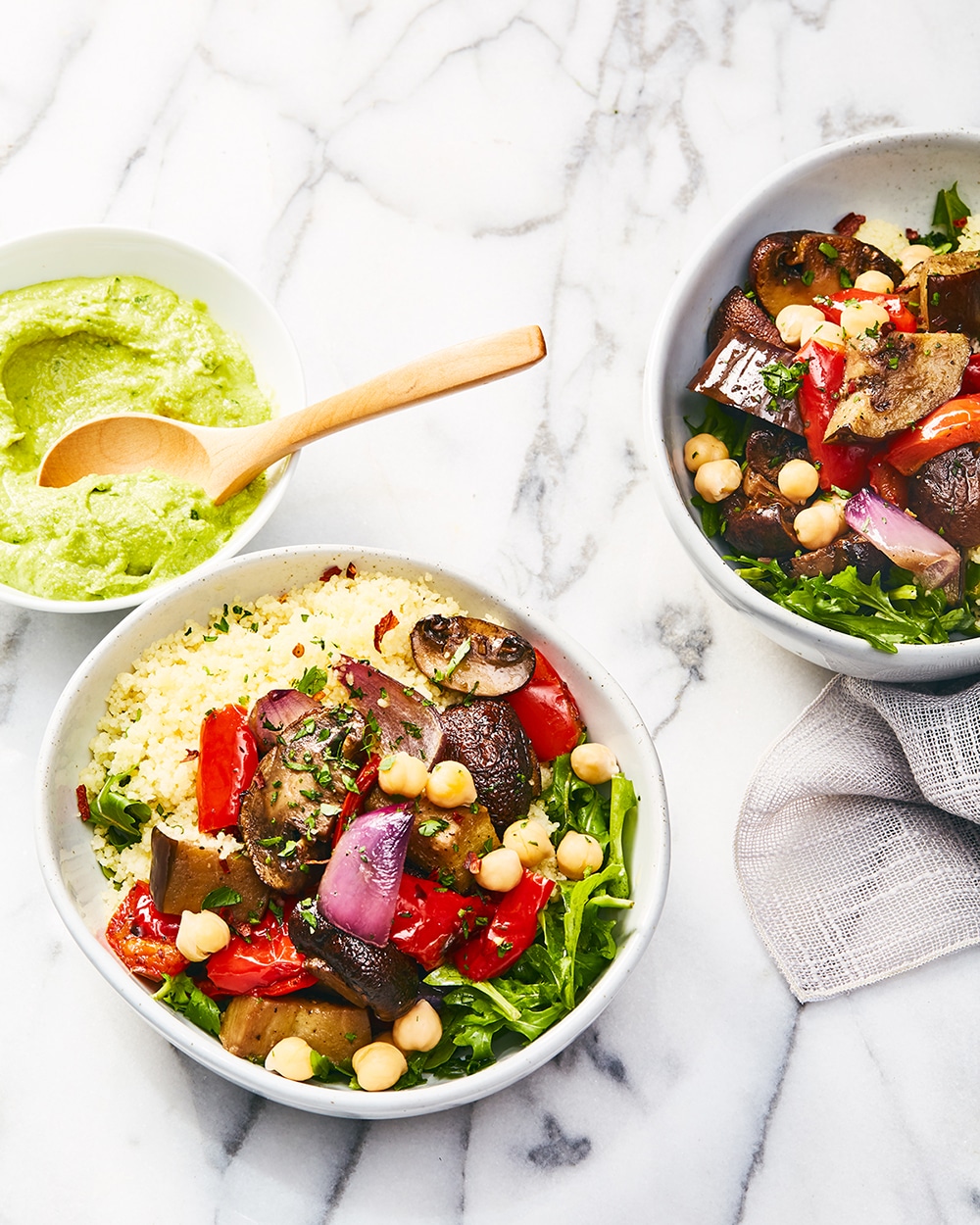 Roasted Veggie Bowl With Chive Hummus, a filling farmer's market bowl with a grain, chickpeas, arugula and hummus as sauce