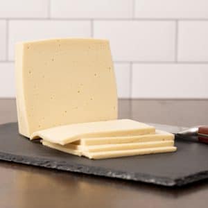 Sliced vegan provolone cheese recipe made with cashews