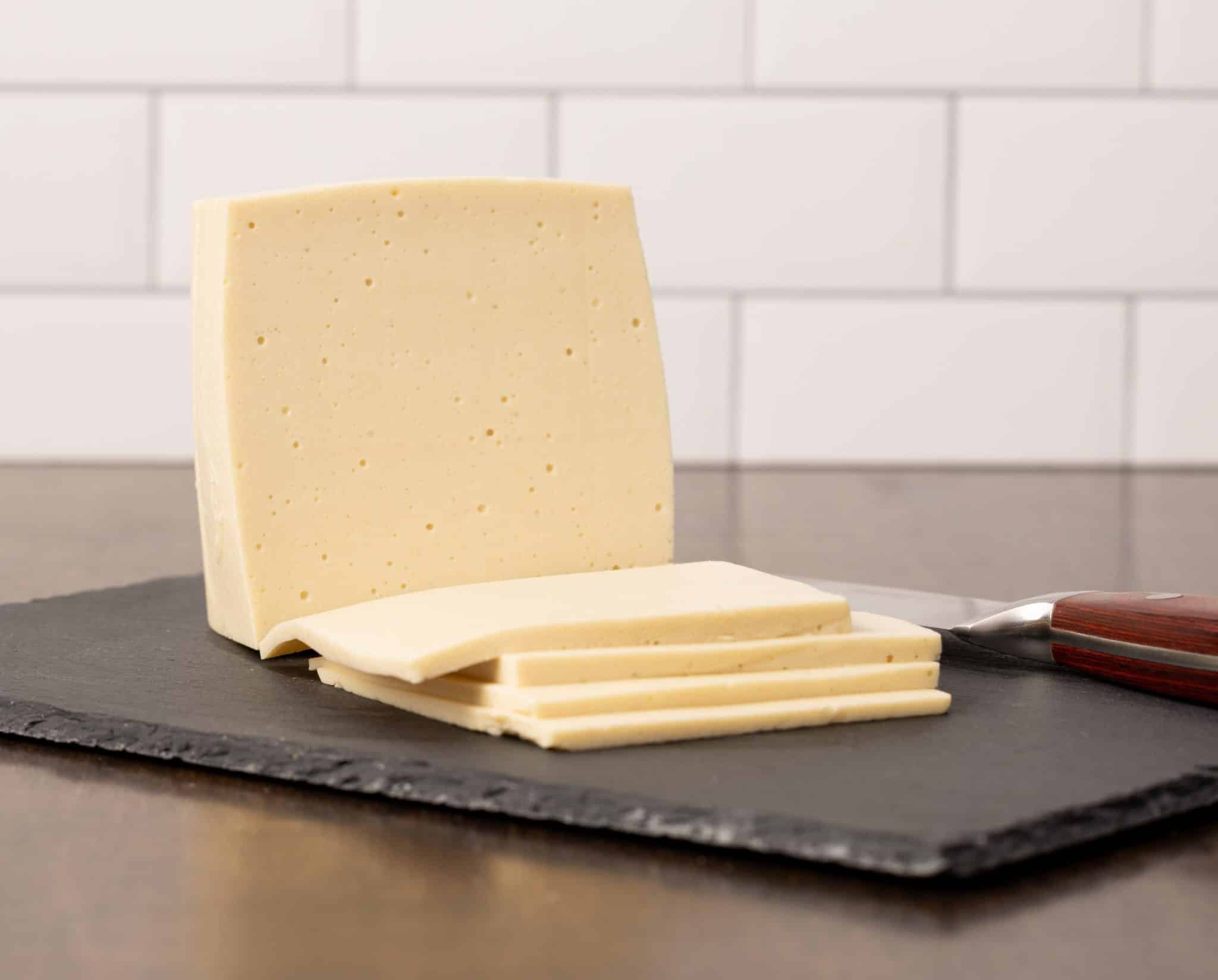 Sliced vegan provolone cheese recipe made with cashews