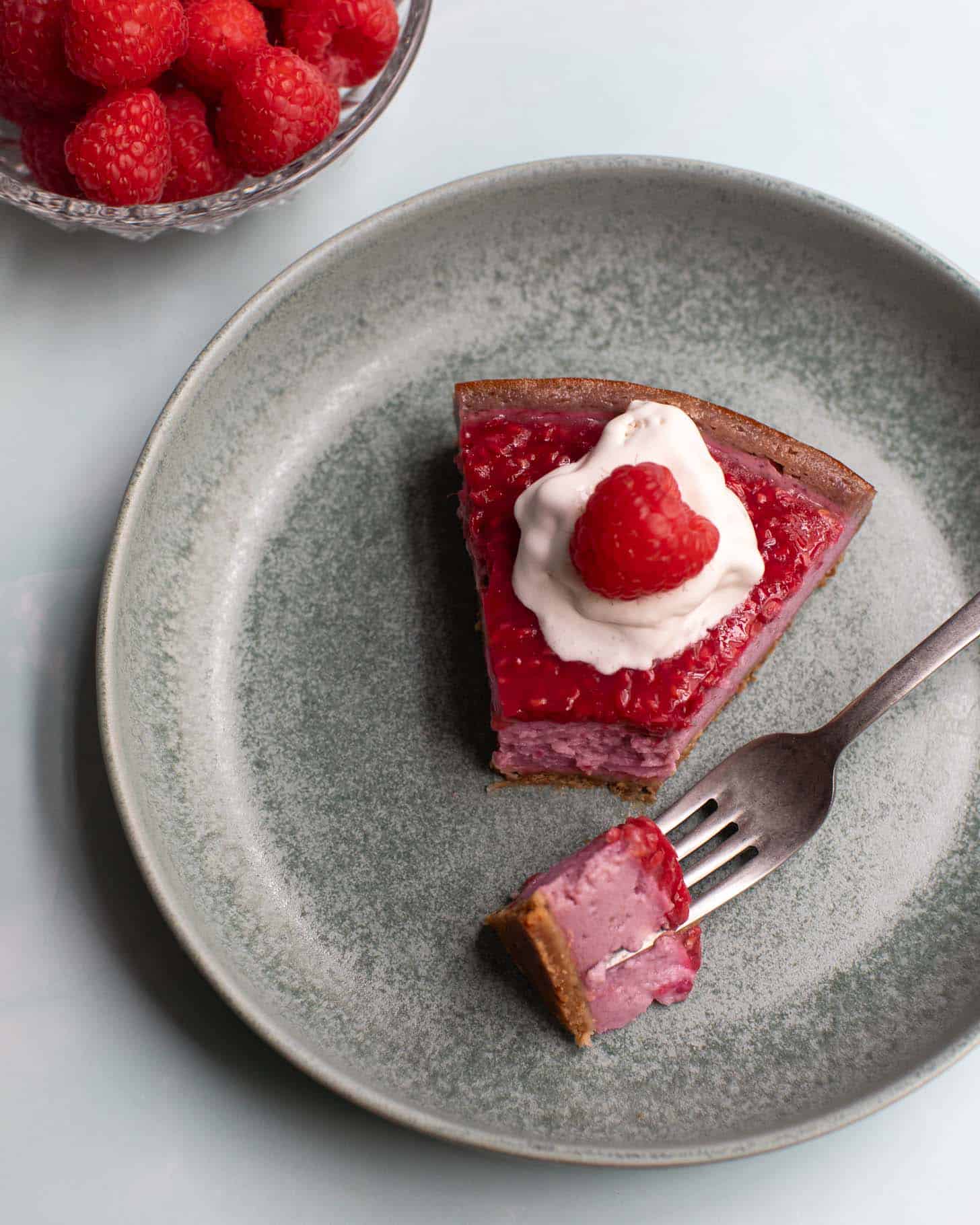 Vegan raspberry cheesecake with whipped topping