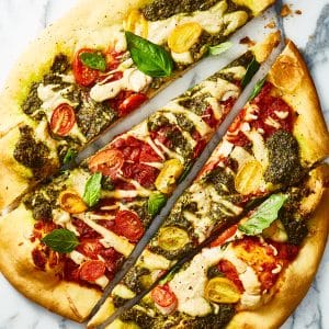 vegan tricolore pizza with liquid mozzarella, cut into long slices